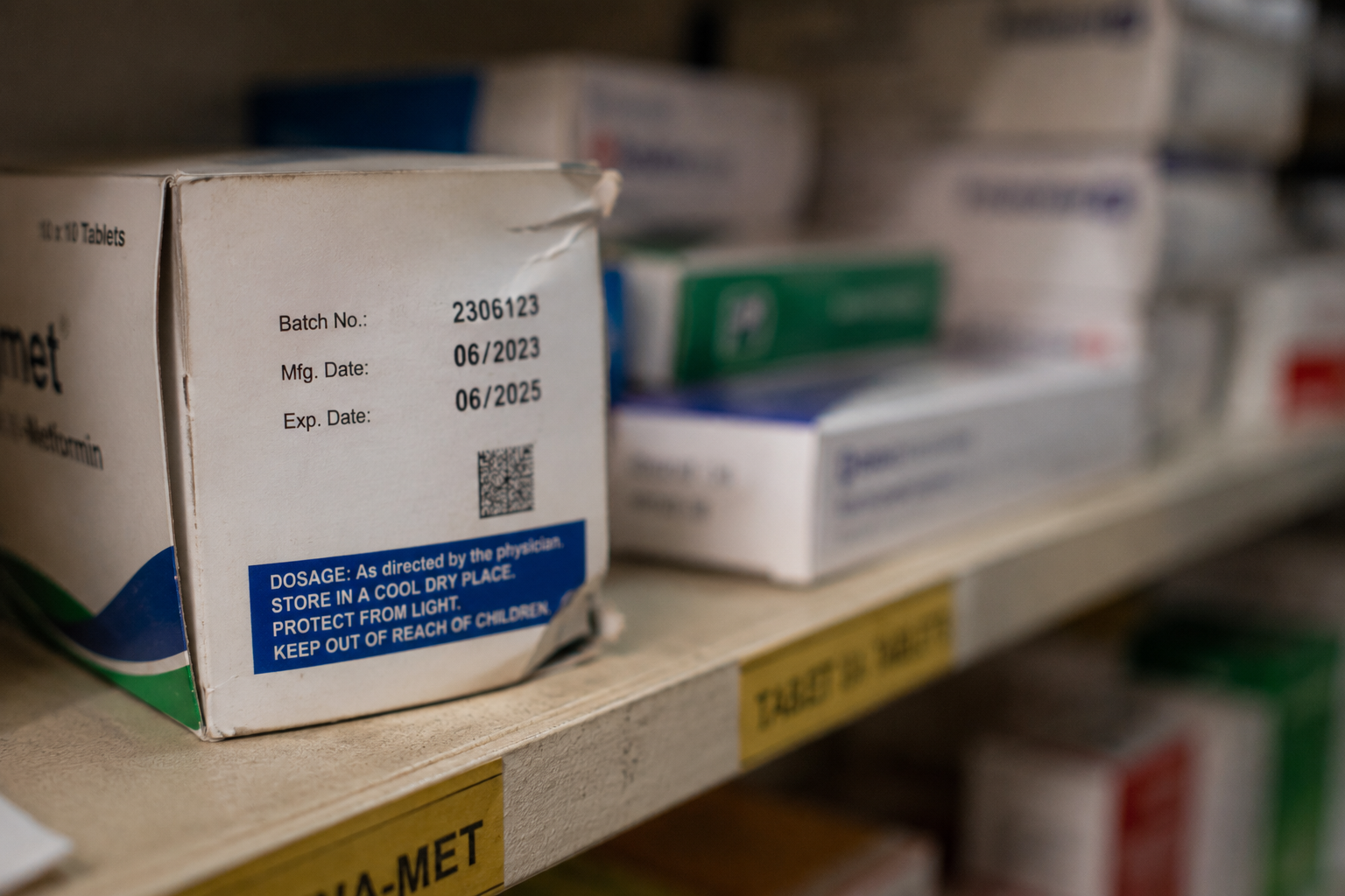Pharmacist at the counter using DawaTrack